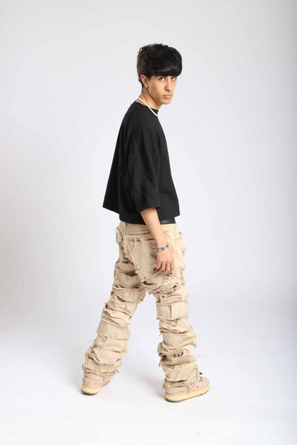 Vaqueros de doble denim beige crema con rotos cosidos