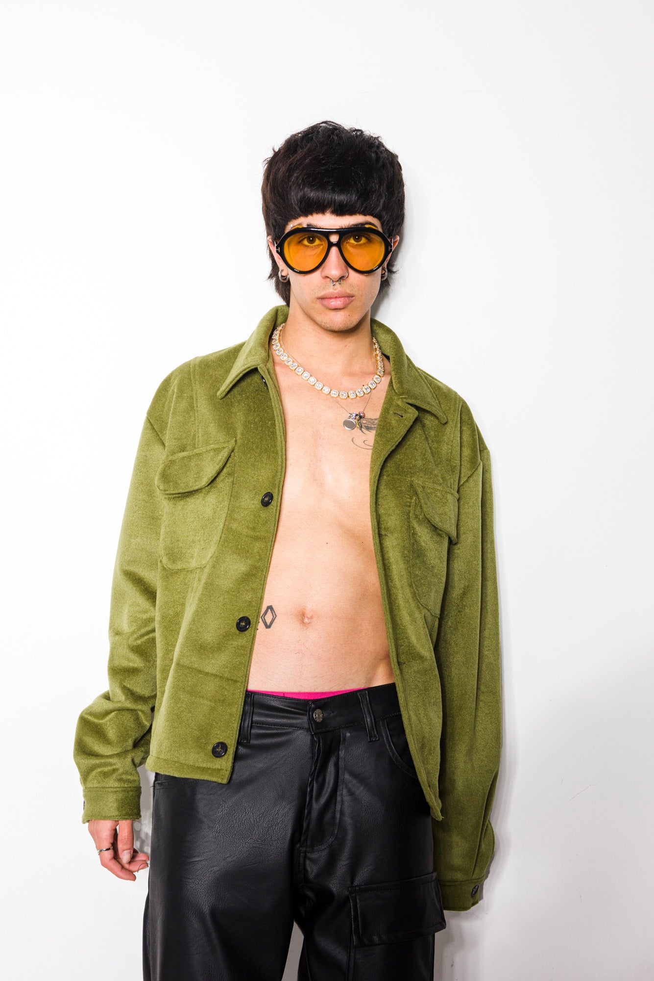 Green cloth jacket with contrasting buttons and pockets